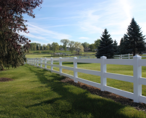 Clean white PVC fence for home exterior